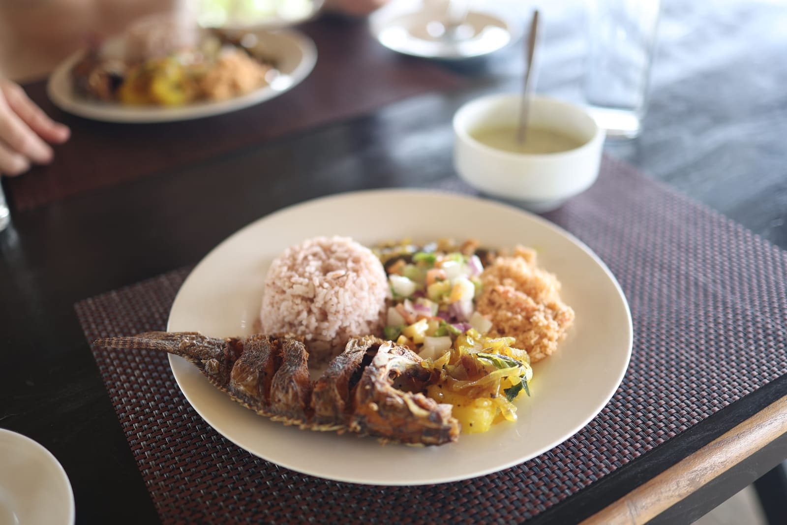 Sri Lankan home-cooked dinner — fish, red rice, sambol, curry