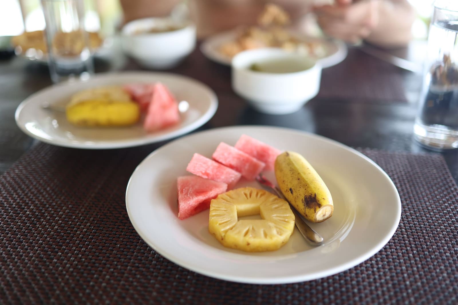 Fresh tropical fruit from the orchard at the breakfast table