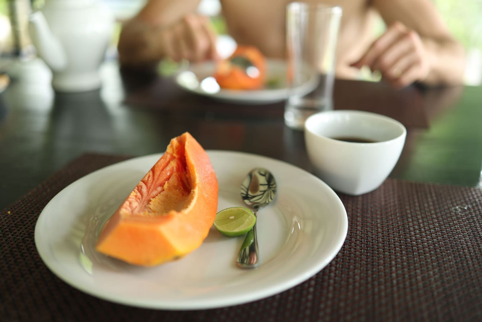 Fresh papaya with lime — picked from the orchard at Aji Fruit Farm